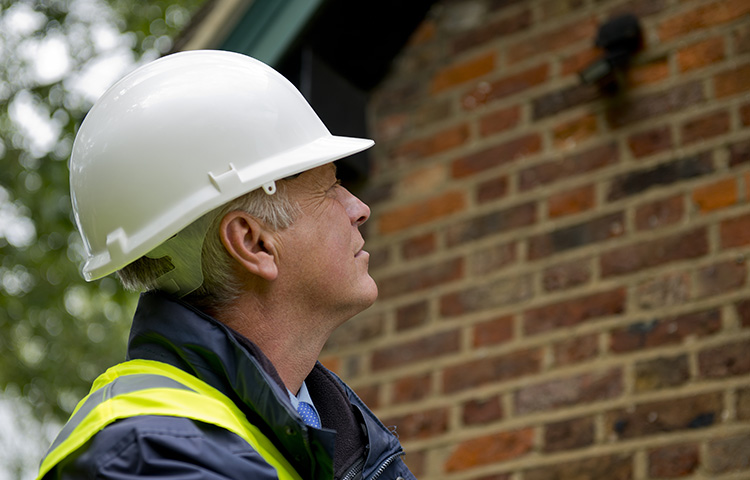 Full Structural Survey for Victorian Properties Protecting Your Heritage Investment - Man Looking at House